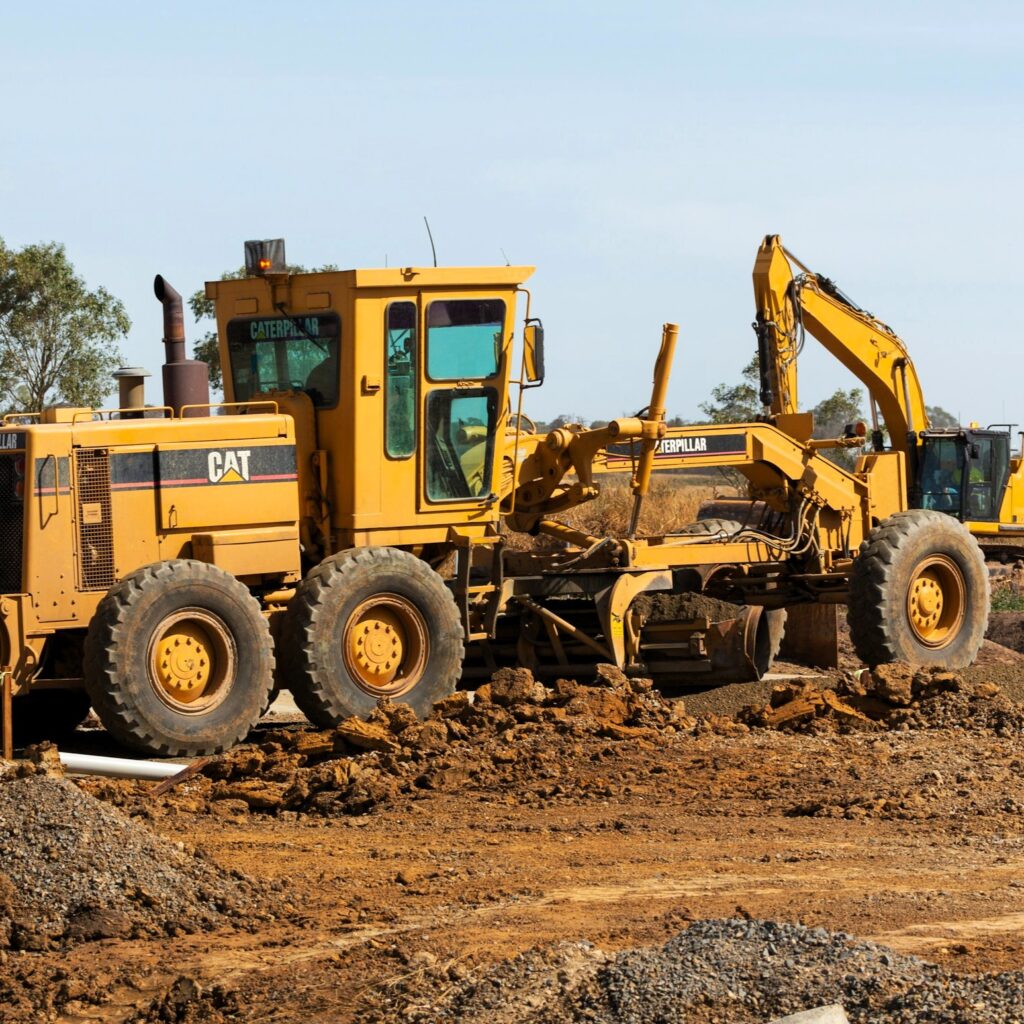 Gelber Grader (Straßenhobel) im Tiefbau vom Straßenbau Stockfoto Unsplash